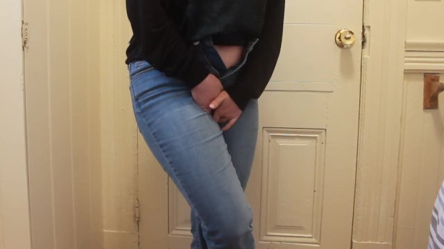 Desperate piss in jeans while waiting for the bathroom