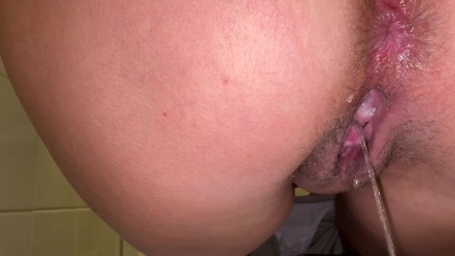 the girl has a hairy pussy with juicy and is peeing again at work