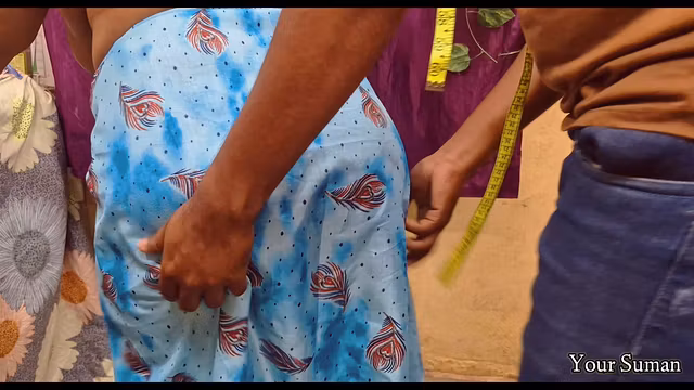 POV Tailor helping to take measurement of clothes