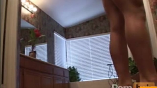 Athletic woman taking her clothes off