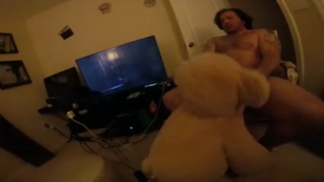 Horny guy fucks giant stuffed bear