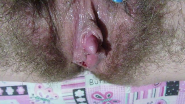 Rubbing my huge clitoris . Hairy pussy close up