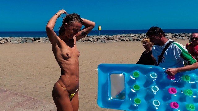 TRAVEL NUDE - Girl with small tits topless in shower on the public beach