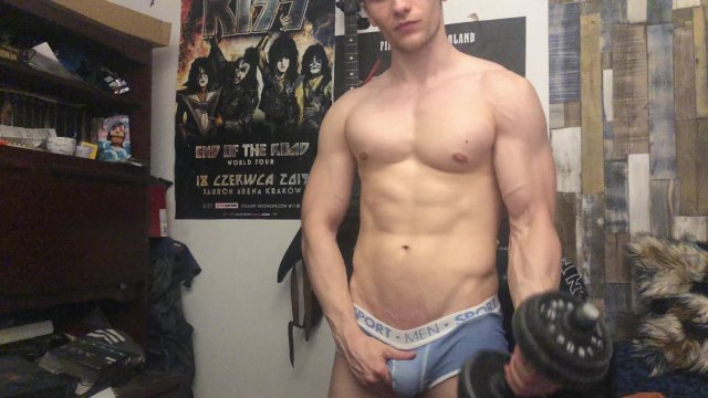Chris Wild doing biceps curls and masturbates his big cock