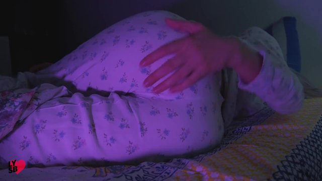 Lady touches herself in bed