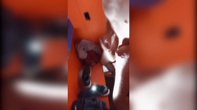 Twink being fucked bareback in a pool's stall and jerks his big cock