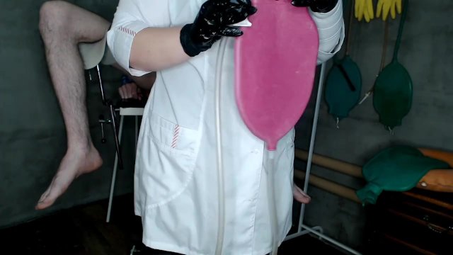 Chubby beautiful nurse gives a 1.5 liter enema bag to the patient