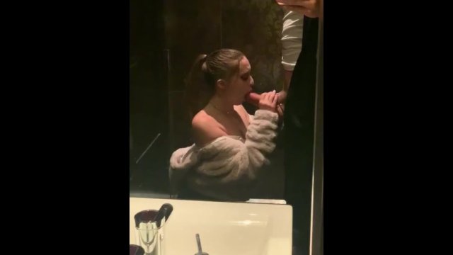 Goregous gal gags on giant cock in grand public bathroom