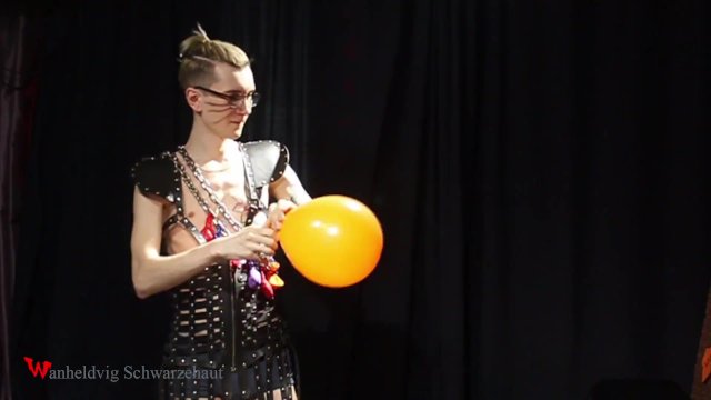 Nicky as a superhero destroys balloons