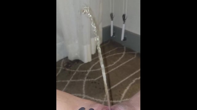 Naughty pisser soaks carpet and drapes