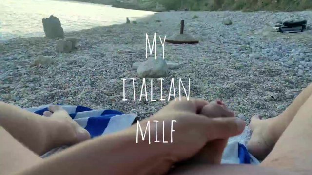 My Wife massages my cock in a public beach