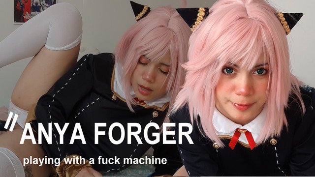Girl in Anya Forger cosplay playing with a fuck machine